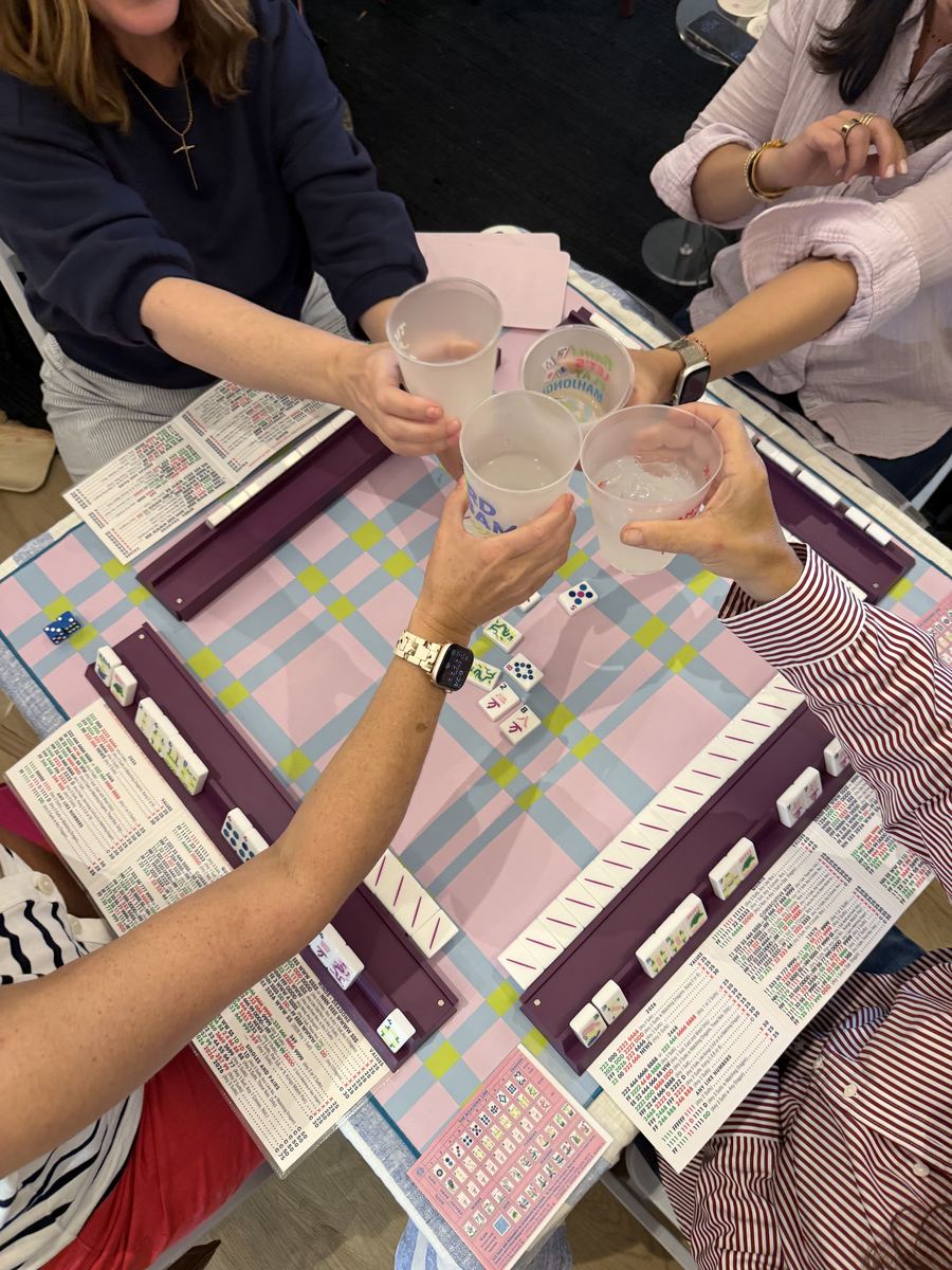 Overhead cheers over mahjong table