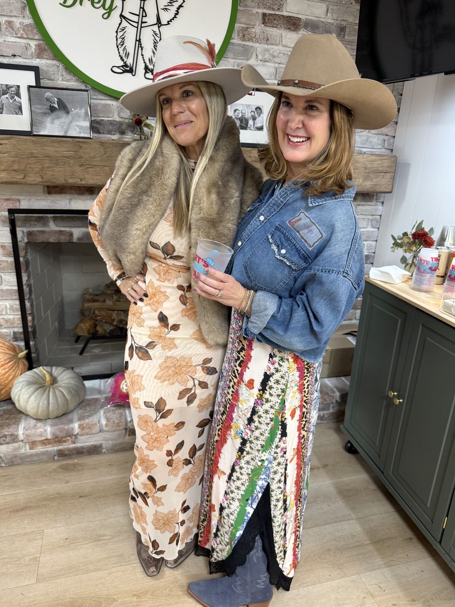 Liz and Leigh in cowboy hats at a mahjong event